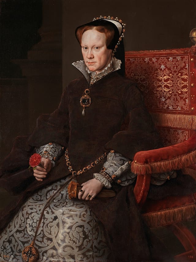 Half-portrait painting of a seated older woman. She is wearing grey and brown robes with a high collar and headpiece. She is holding a red rose in her right hand.